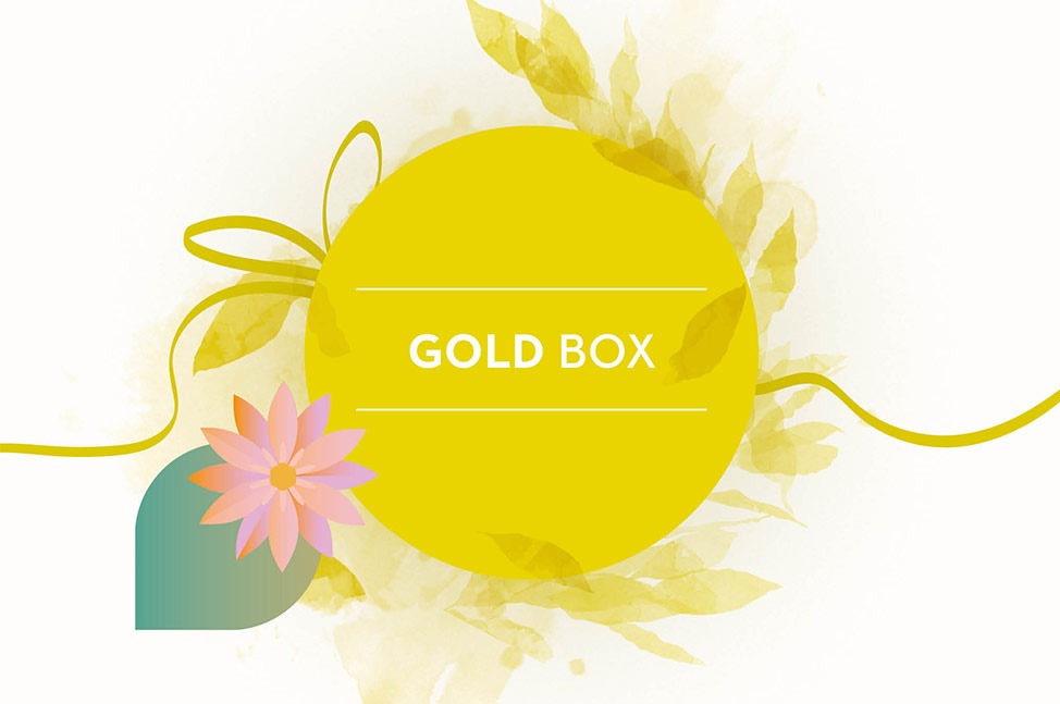 Un cercle jaune vif avec le texte "GOLD BOX" en blanc au centre, entouré de motifs floraux en aquarelle dans différentes nuances de jaune, créant une sensation douce et élégante. Un ruban jaune s'ajoute subtilement à la composition, renforçant l'aspect ra